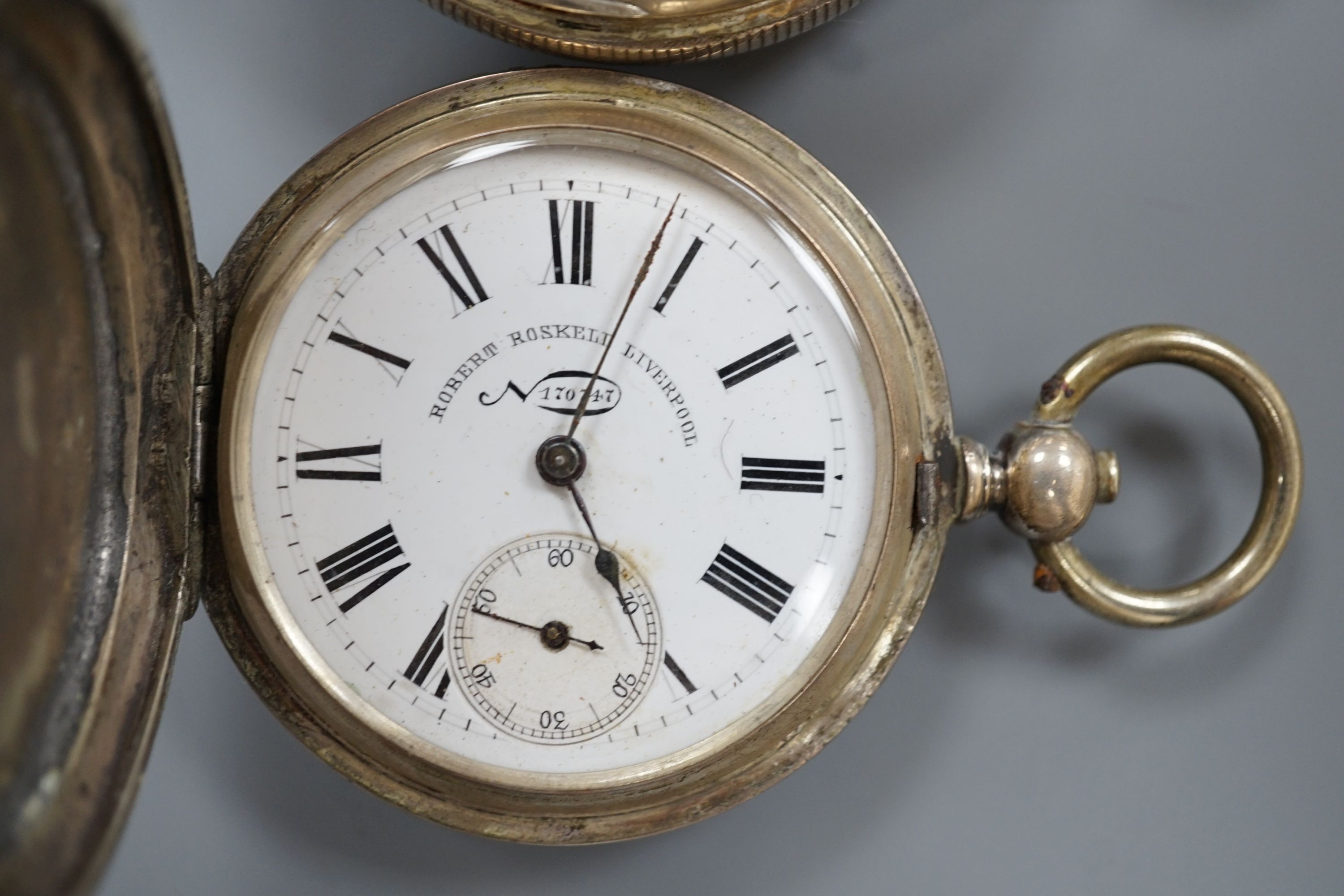 A 19th century white metal hunter pocket watch, by Robert Roskell, Liverpool, engraved with train on a bridge and one other silver hunter pocket watch.